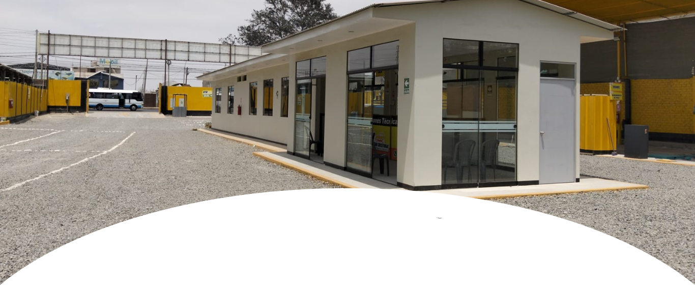 Image of a vehicle undergoing technical inspection in a modern facility